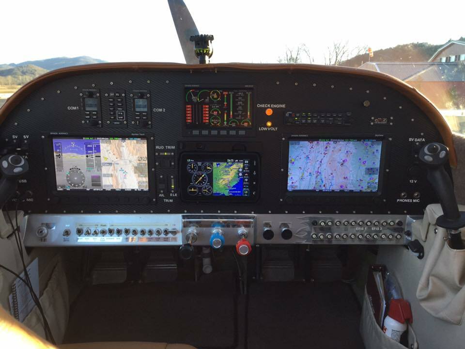 Glass cockpit panel with Dynon avionics displays in a small aircraft